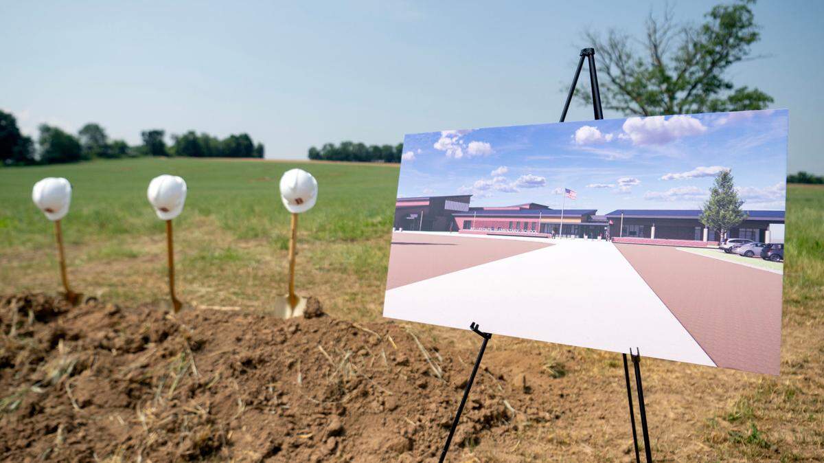 A rendering of the new Bellefonte elementary school is on display during a June 21 groundbreaking ceremony. Construction is expected to be complete in spring 2026, and the district has started discussing possible building closures once it's open.