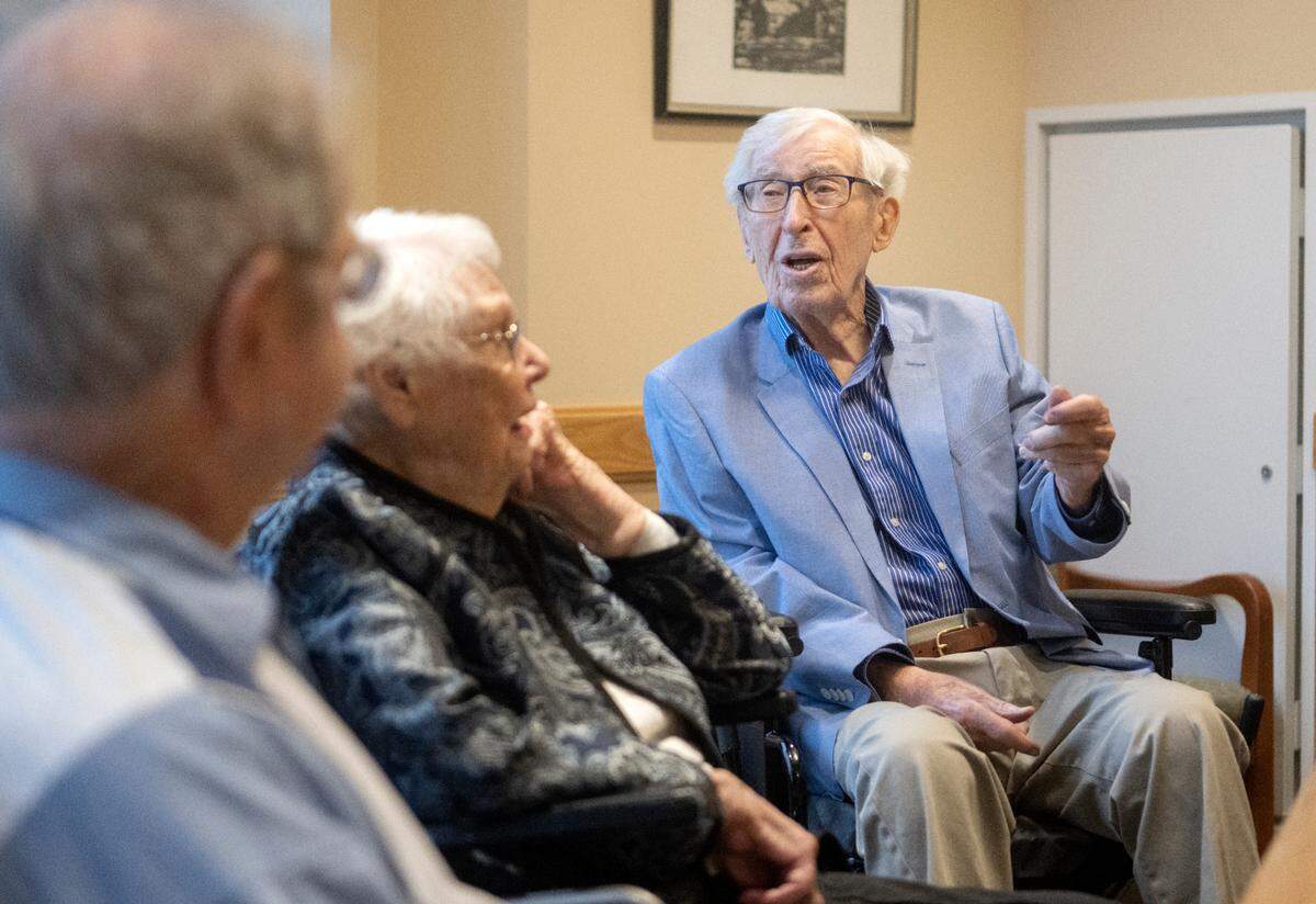Emory Brown, 101, shares a story about his first car on Feb. 22 with fellow centenarians at Foxdale Village.