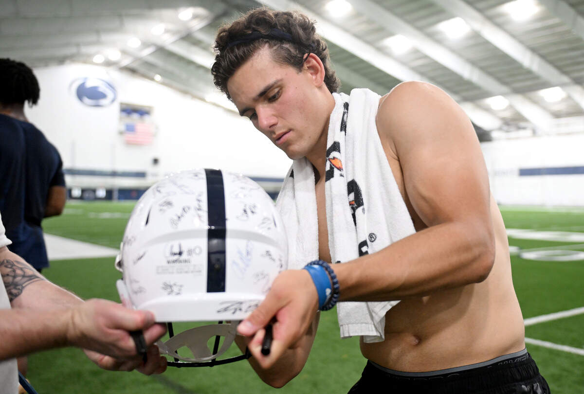 Penn State quarterback Rocco Becht signs autographs for fans after Lift For Life on Wednesday, July 1, 2026.