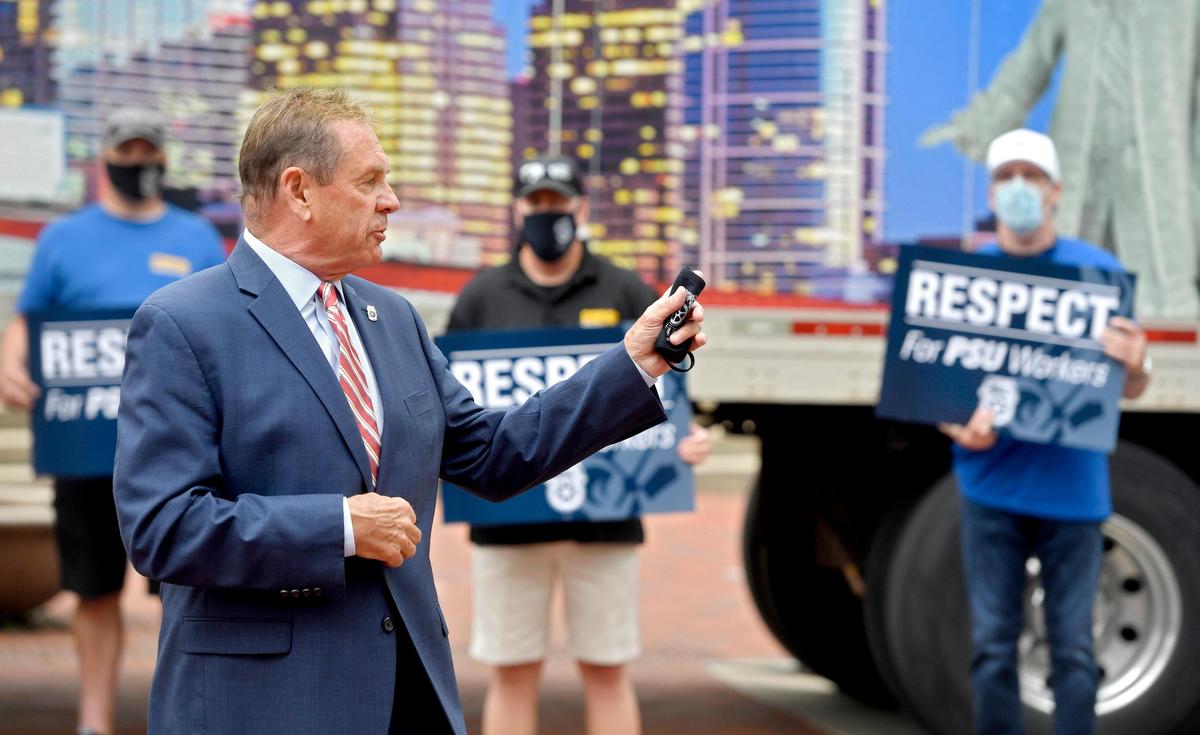 President of Pennsylvania conference of Teamsters Bill Hamilton speaks to a small crowd of employees as they rally outside of the HUB on the Penn State campus on Wednesday, May 27, 2020.