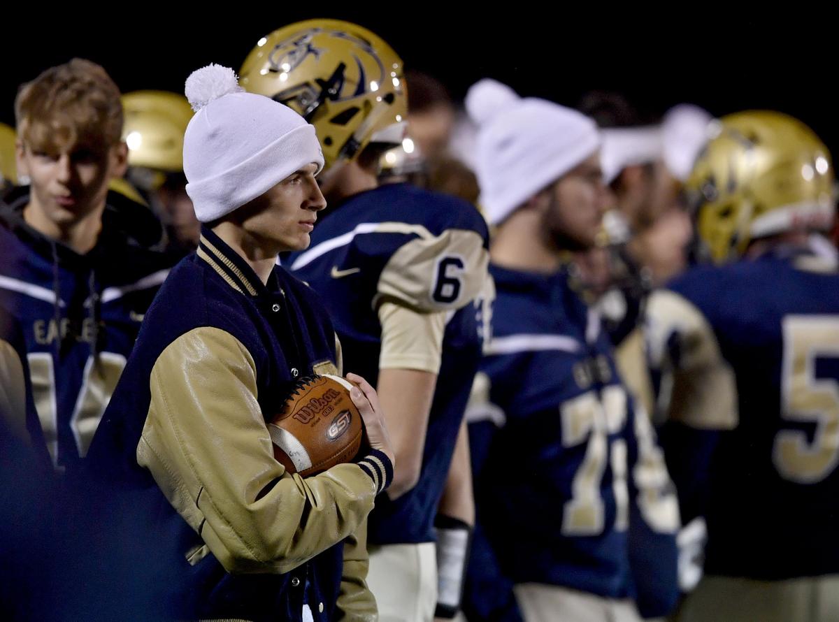 Bald Eagle Area starting quarterback Jaden Jones holds a football on the sides lines of the game as he and several other starters did not play in the Curtin Bowl on Friday, Oct. 25, 2019.