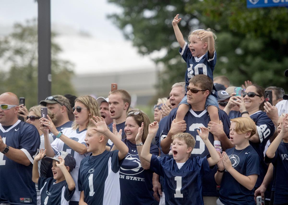 Fans cheer as the Penn State football team arrives for the season opener against Appalachian State at Beaver Stadium on Saturday, September 1, 2018.