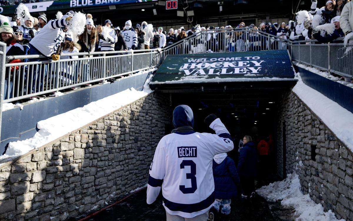 Fans cheer for Penn State quarterback Rocco Becht as he walks through the tunnel at Beaver Stadium before the hockey game at Beaver Stadium on Saturday, Jan. 31, 2026.