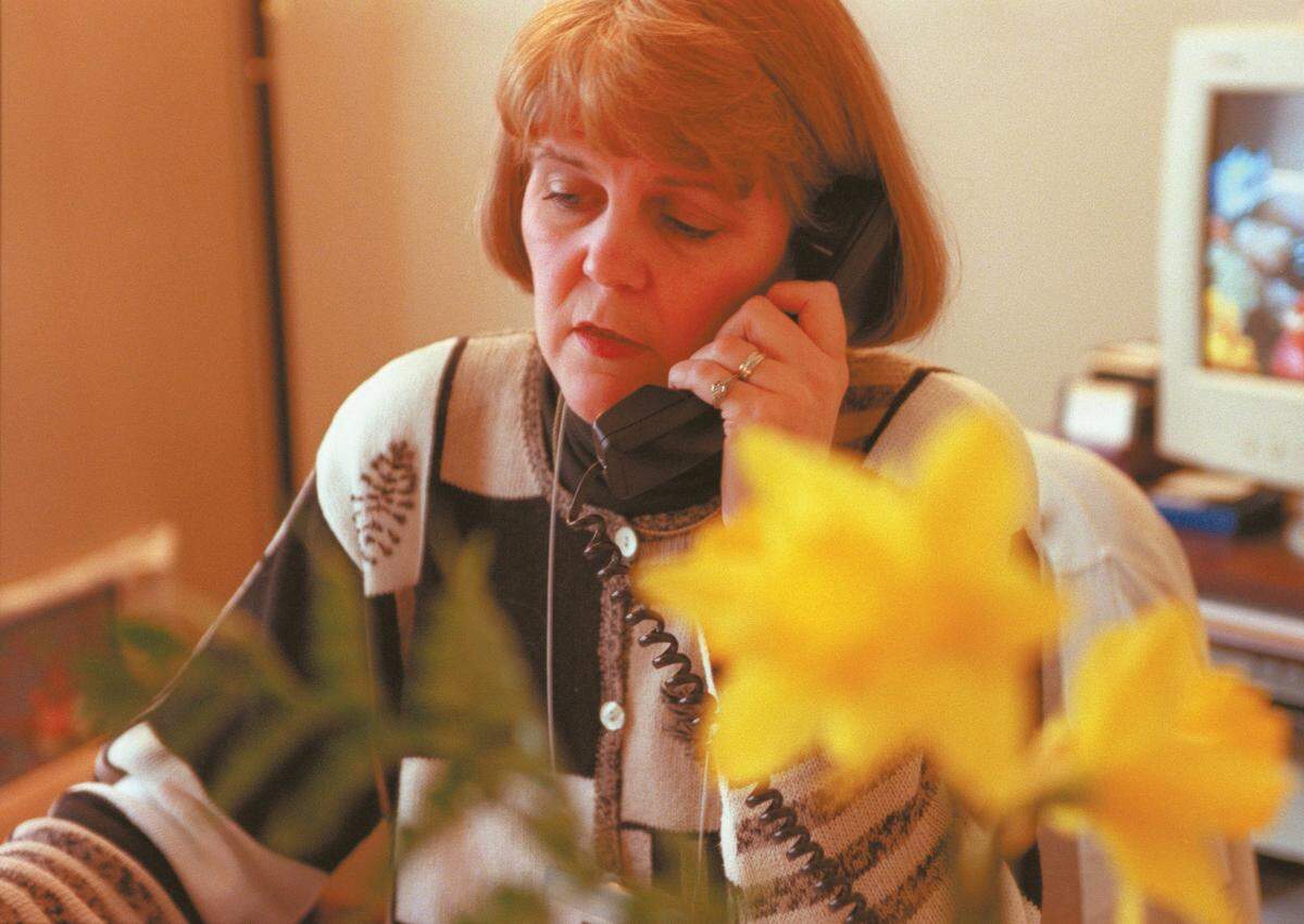 Anne Ard talks on the phone in her office at the Centre County Woman’s Resource Center in March 2001.