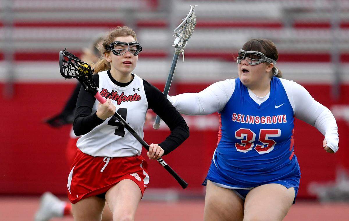 Bellefonte’s Bethany Book runs with the ball ahead of a Selinsgrove defender during the game on April 5.