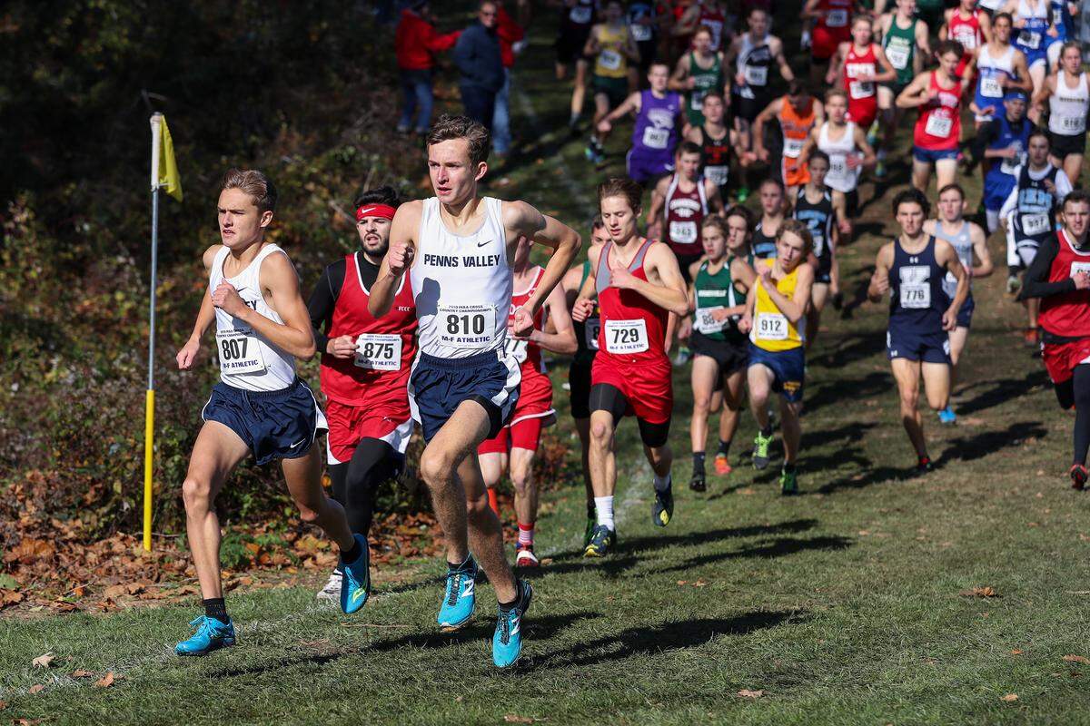 Penns Valley’s Colton Sands and Brendan Colwell lead the pack in the PIAA Class 2A boys cross-country championship race held Saturday, November 2, 2019 at Parkview Cross Country Course in Hershey.