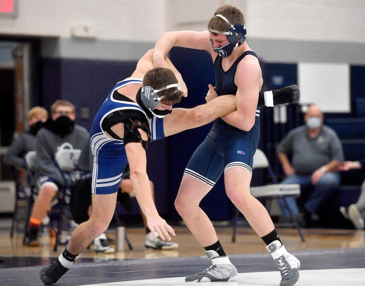 Philipsburg-Osceola’s Luke Hughes trips up Penns Valley’s Malachi Thompson in the 152 lb bout during the match on Tuesday, Jan. 19, 2021. Hughes won by major decision, 9-1.