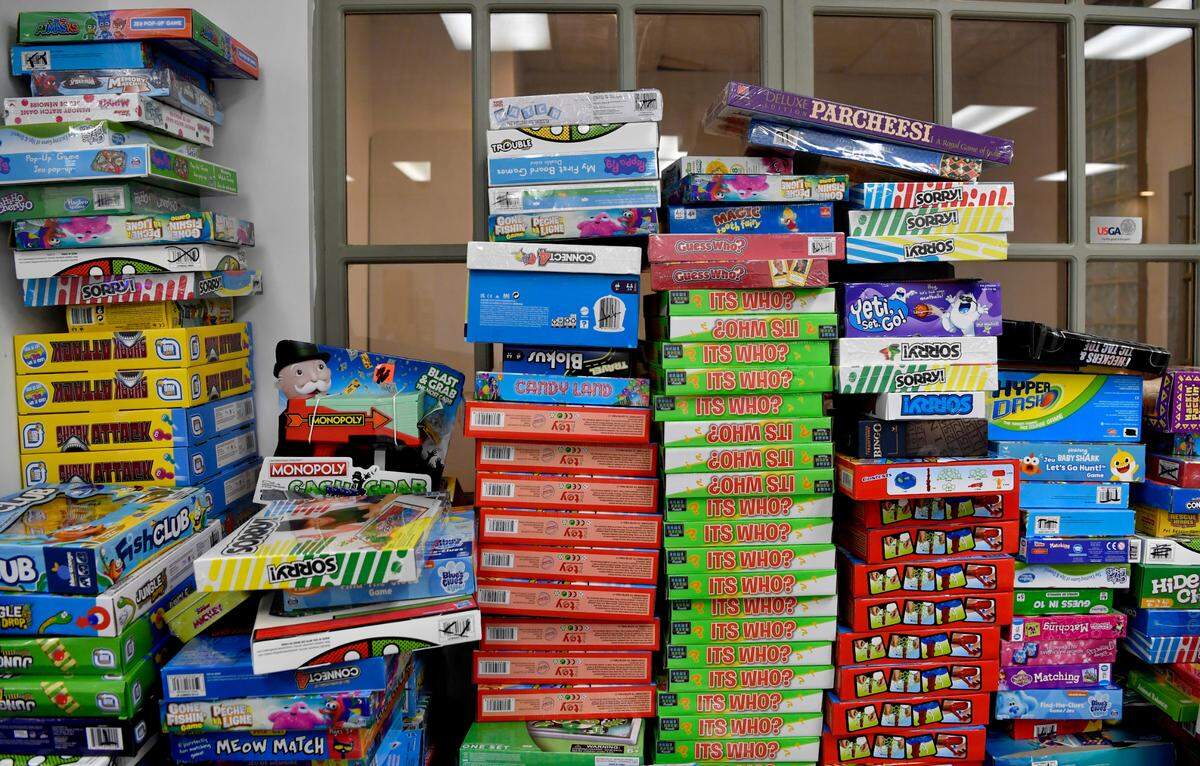 Games are stacked up along a wall at the Toys for Tots Unregistered Site at Hills Plaza on Tuesday.
