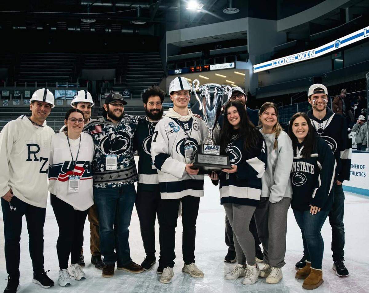 After Penn State women’s hockey won its third straight AHA title, the Roar Zone got a picture with the AHA trophy.