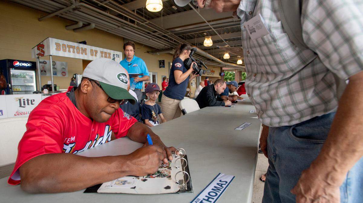 Former Penn State football star and NFL player Blair Thomas signs autographs for fans at Medlar Field on Tuesday, August 14, 2018.  Thomas was to play in the celebrity softball game at the New York Penn League All Star game, but it was canceled due to the rain.  