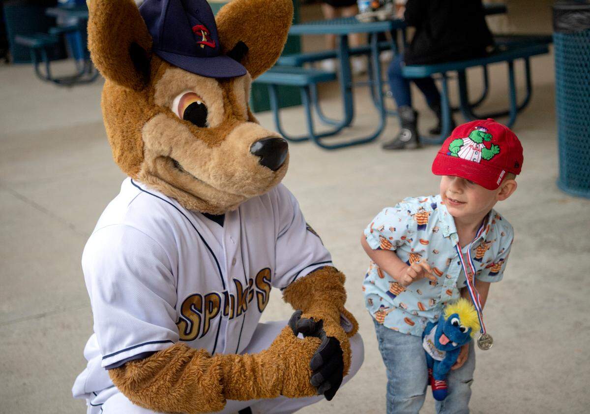 Kyle Shaffer gets a photo with Ike at the State College Spikes on Monday, May 24, 2021.