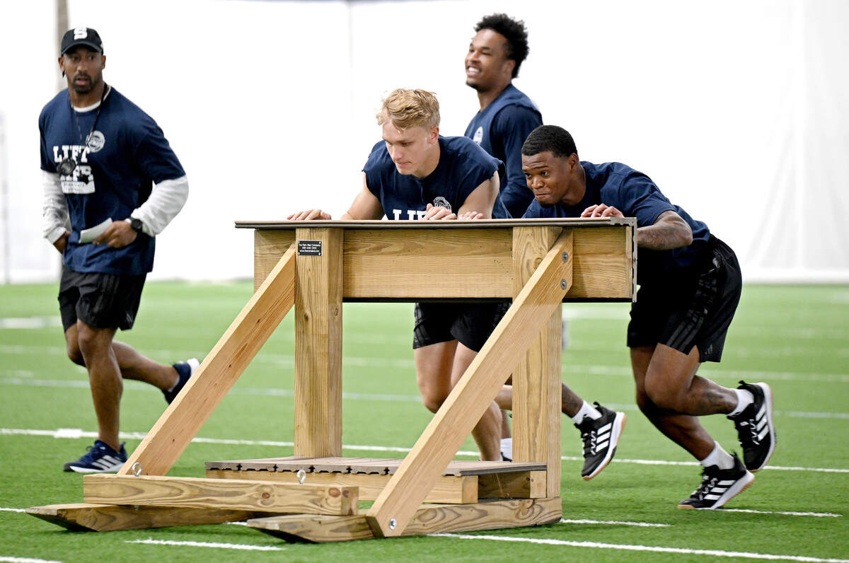 Penn State running back Carson Hansen and teammate  push the sled during Lift For Life on Wednesday, July 1, 2026.