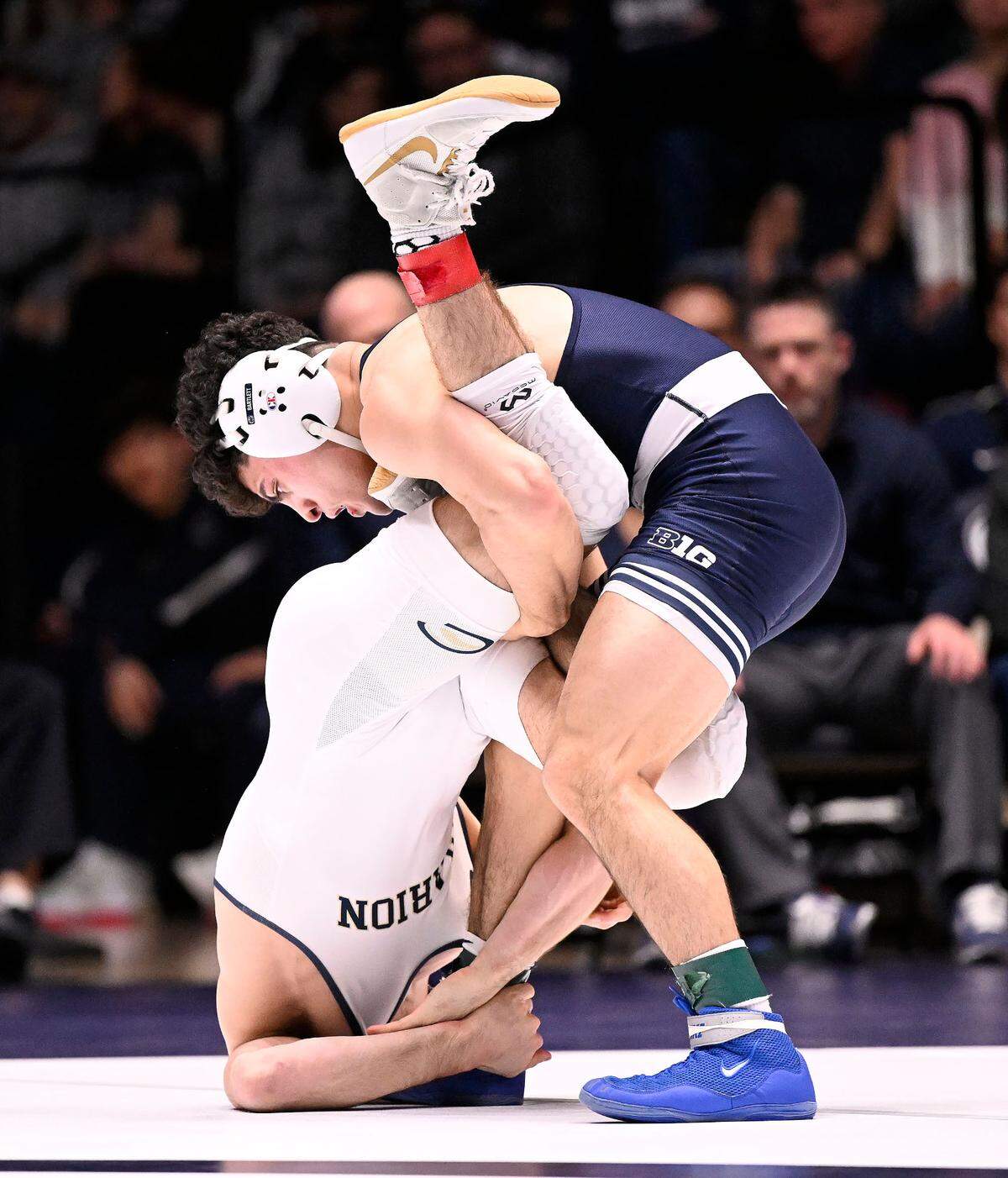Penn State’s Beau Bartlett (top) takes down Clarion’s Seth Koleno at 141 pounds Sunday, Feb. 19, 2023, at Rec Hall. Bartlett defeated Koleno, 12-4. Penn State defeated Clarion 40-6.