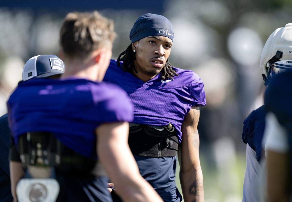 Penn State wide receiver Chase Sowell talks with teammates during practice on Thursday, April 9, 2026.