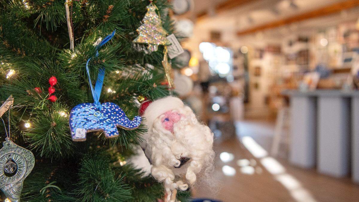 Handmade ornaments hang on the tree at The Lemont Gallery Shop, which offers work by local artists.