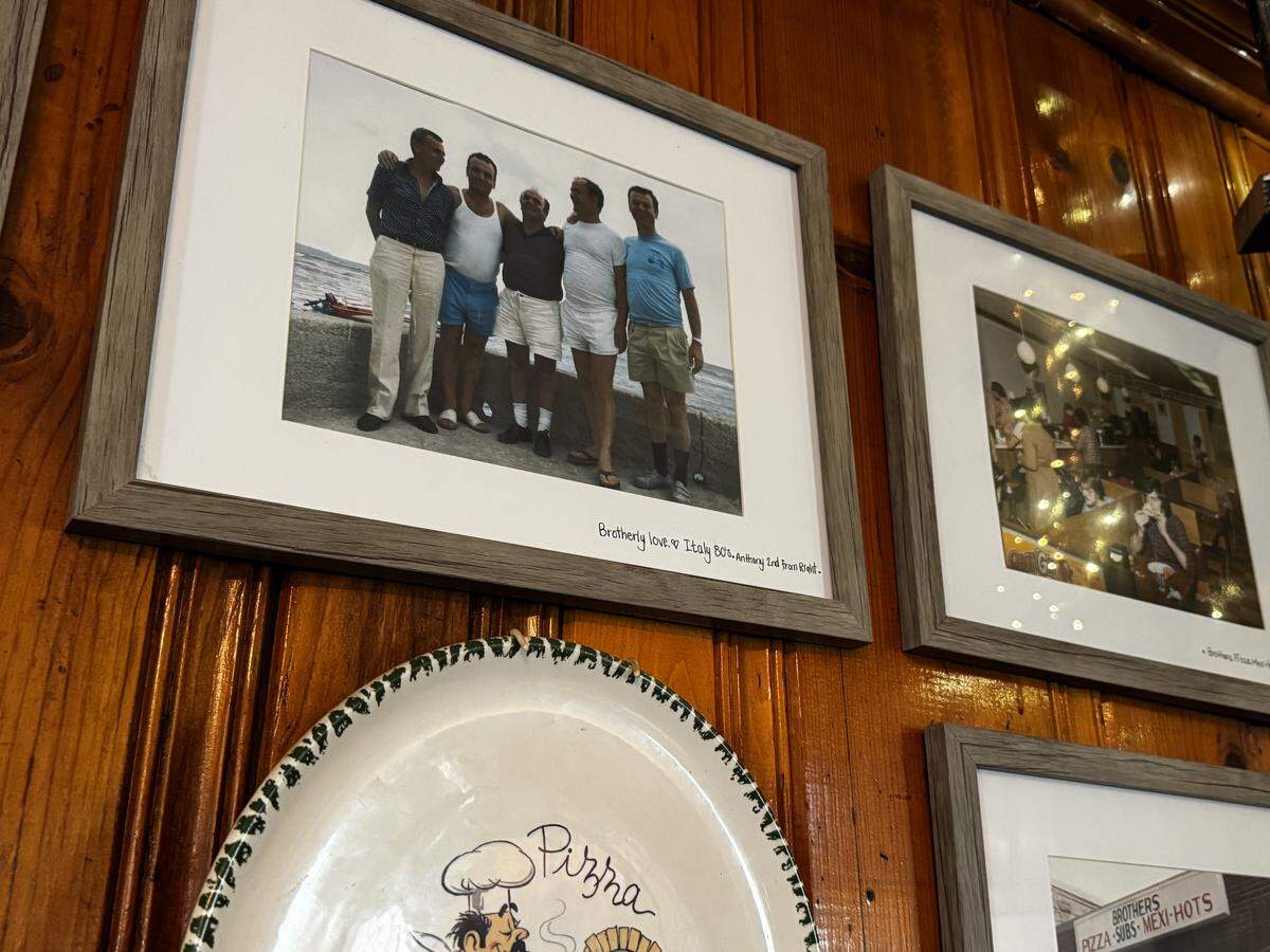 The undated photo in the top left shows, from the left, Salvatore, Vincenzo, Pietro, Antonio and Bernardo Pistone. The photo, shown June 2, 2026, in The Original Brother’s Pizza of Snow Shoe, was provided to the shop by co-owner Josephine Findley.