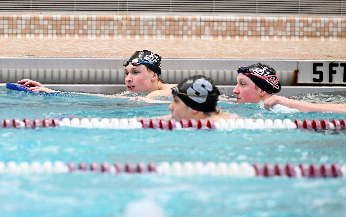 The State College swimmers Evan Koehle, Molly Workman and Leo Garlicki talk during practice on Thursday, March 5, 2026.  