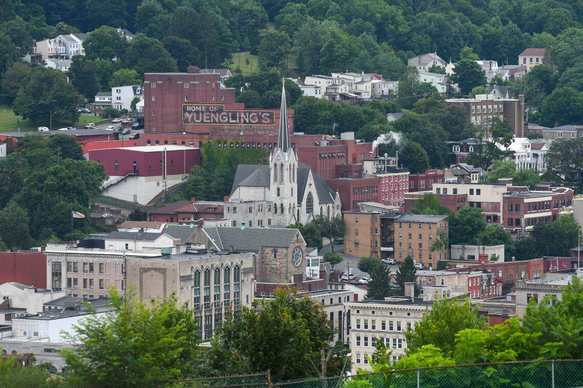 View of the city of Pottsville from Nativity BVM High School on Thursday, July 16, 2020. In view is St. Patrick Roman Catholic church in front of the D.G. Yuengling & Son Inc. brewery on Mahantongo Street.