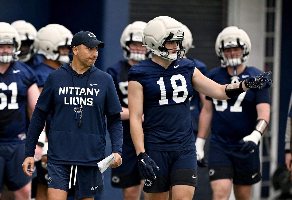 Penn State football coach Matt Campbell and tight end Ben Brahmer during spring practice on Thursday, March 26, 2026.  