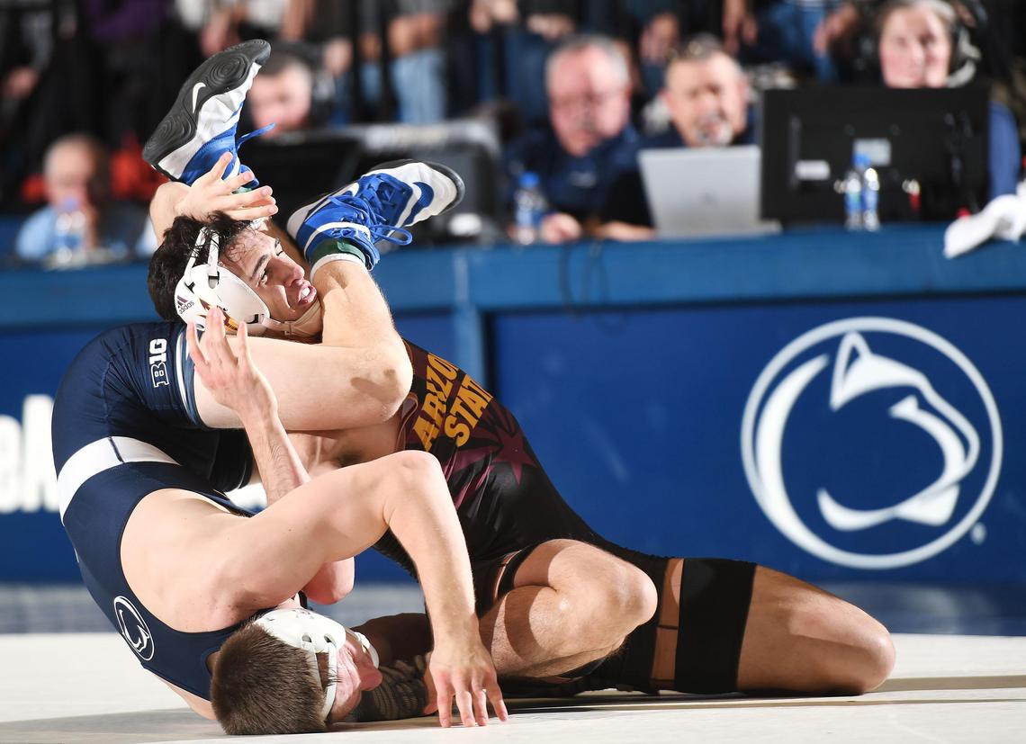 Penn State’s Jason Nolf, 157 lbs, (left) takes down Arizona State’s Christian Pagdilao Friday at Rec Hall in State College. Nolf defeated Pagdilao, 18-5. Penn State defeated Arizona State, 41-3. (For the CDT/Steve Manuel)