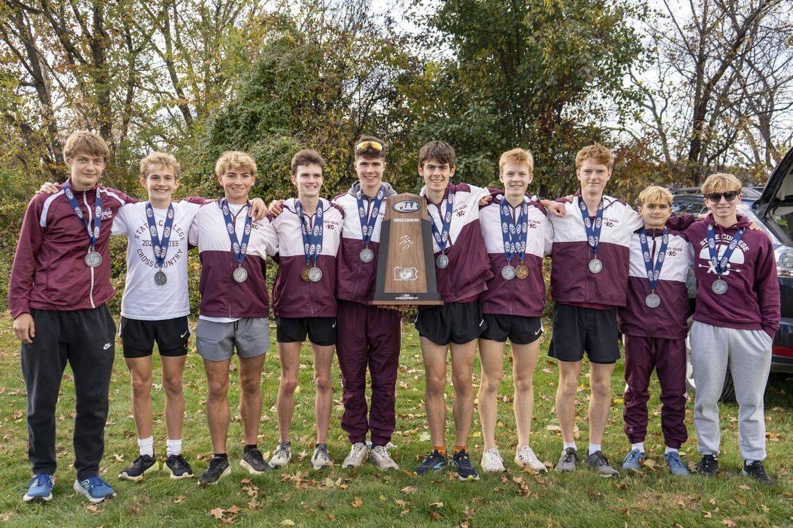 From left, State College cross-country’s Adrian Doran, Tommy Ruffing, Eamon Drohan, Theo Oppermann, Kyle Fritzsche, Owen Viglione, Luke Bradbury, Ben Alexander, Dexter Walker and Liam Coughlin pose Saturday, Nov. 1, 2025 with medals from the PIAA cross-country championships.