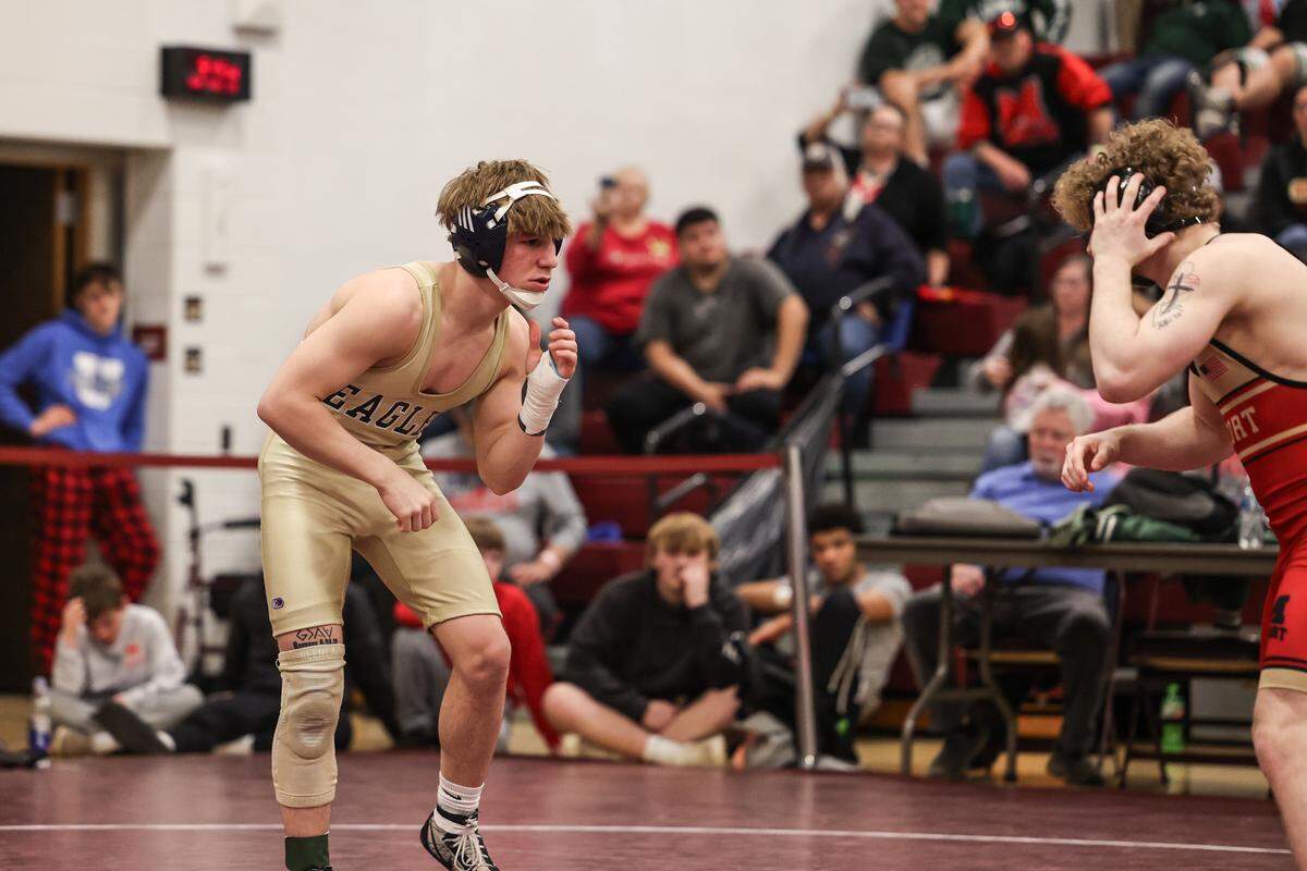 Bald Eagle Area’s Tanner Guenot looks for an opening on Bishop McCort’s Austin Carfley in their 133-pound championship match of the PIAA Class 2A Southwest Regional Championships on Saturday, Feb. 28, 2026 in Altoona. Guenot topped Carfley, 4-2.