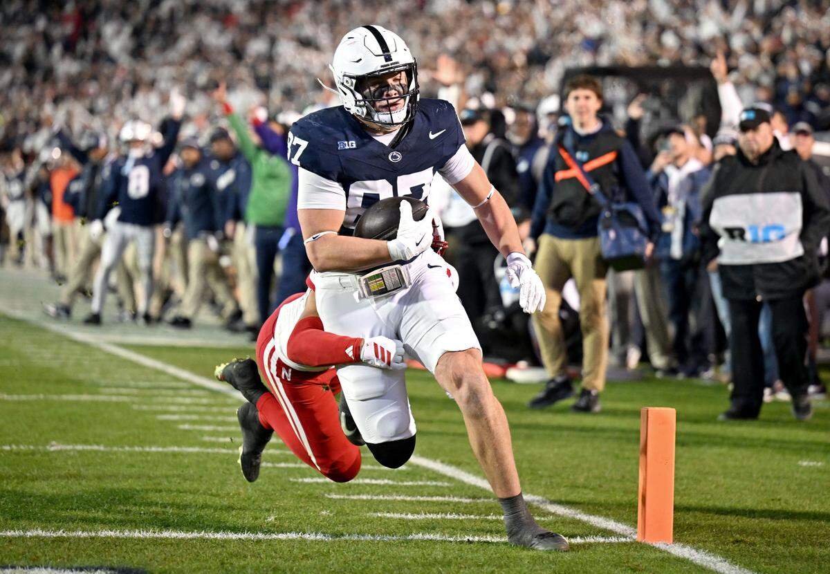 A Nebraska defender can’t stop Penn State tight end Andrew Rappleyea as he runs in for a touchdown during the game on Saturday, Nov. 22, 2025, at Beaver Stadium.