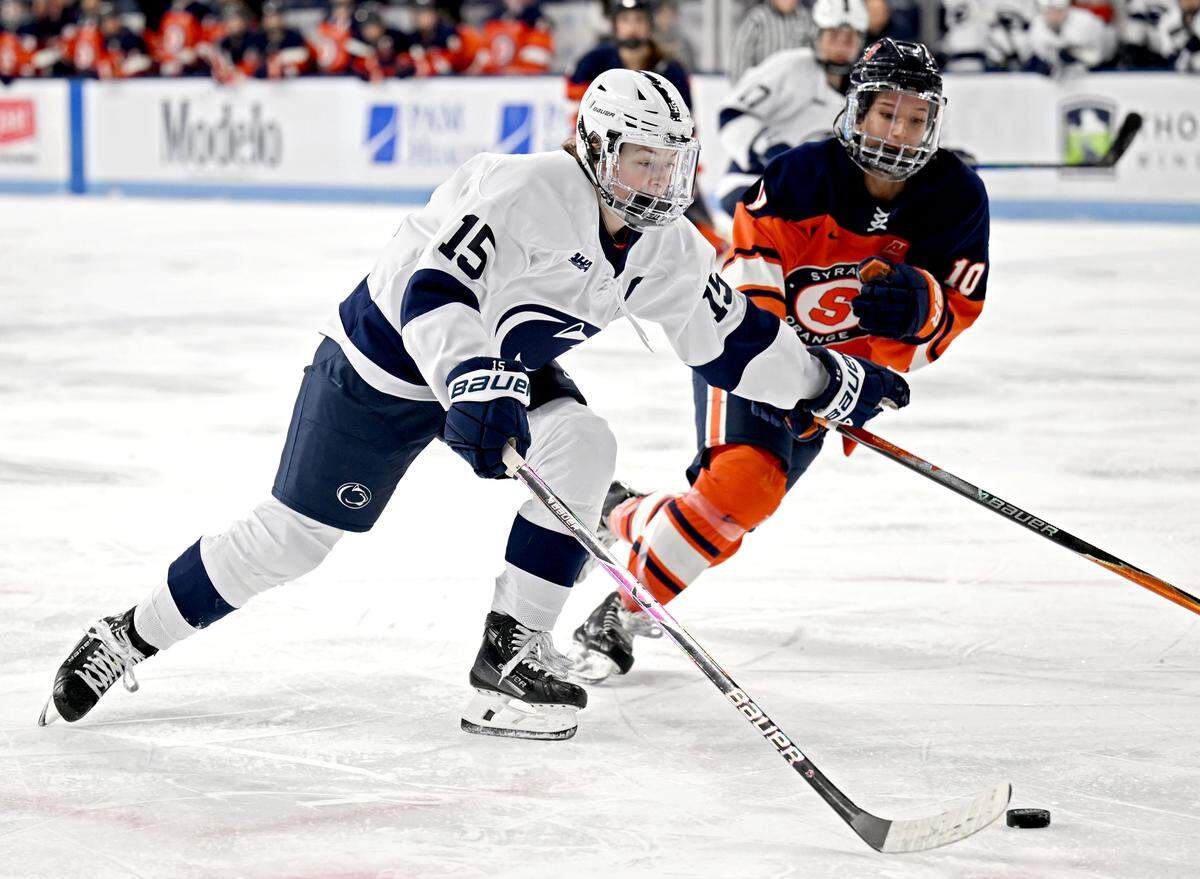 Penn State’s Tessa Janecke pushes past Syracuse’s Jessica Cheung during the game on Friday, Nov. 14, 2025 at Pegula Ice Arena. 