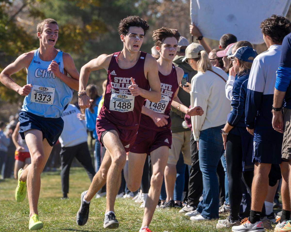 State College senior Isaac Oppermann and sophomore Theo Oppermann were the Little Lions’ two top finishers at the PIAA Class 3A State Boys Championship in Hershey, where State College brought home the team state title.