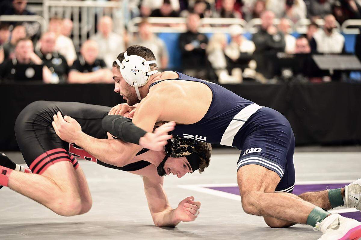Penn State’s Shayne Van Ness defends a shot attempt from Rutgers’ Andrew Clark in their 149-pound consolation semifinals match of the Big Ten championships on March 9 inside Welsh Ryan Arena in Evanston, Ill. Van Ness defeated Clark, 12-1.