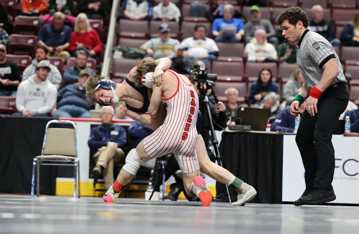Bald Eagle Area’s Coen Bainey goes for a throw on Bermudian Springs’ Hayden Yacoviello-Andrus in their 127-pound consolation finals match of the PIAA Class 2A Championships on Saturday, March 11, 2023 at the Giant Center in Hershey. Bainey had to injury default out of the match in 2:28.
