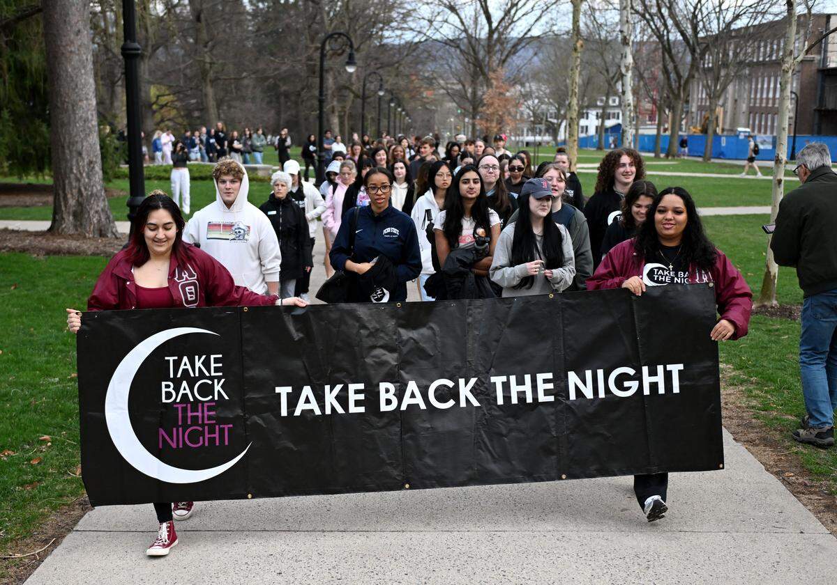 Members of Lambda Theta Alpha lead the march for “Take Back the Night” on the Penn State campus on Wednesday, April 1, 2026.  