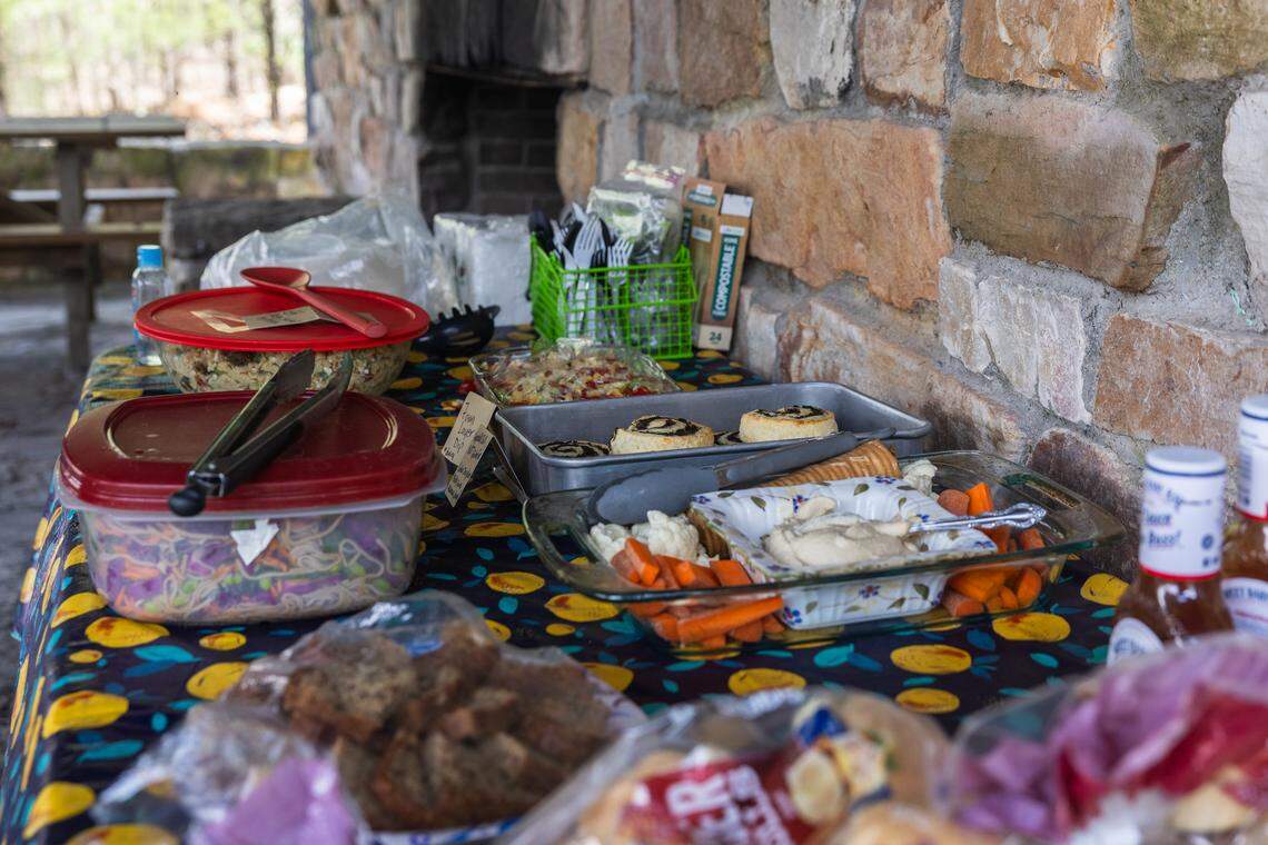 A potluck is held at Whipple Dam State Park in Petersburg, Pa., on Saturday, April 18, 2026. After the cleanup, volunteers gathered for a potluck to celebrate their efforts. The Clearwater Conservancy organized volunteers across Centre County to clean up public green spaces.