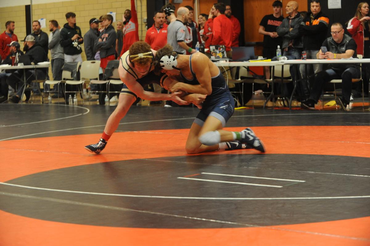 Penns Valley’s Colten Shunk (right) looks to finish off a takedown of Bald Eagle Area’s Dawson Lomison in their 133-pound quarterfinals match of the Laurel Highlands Athletic Conference tournament on Friday at Tyrone. Shunk beat Lomison, 12-4.