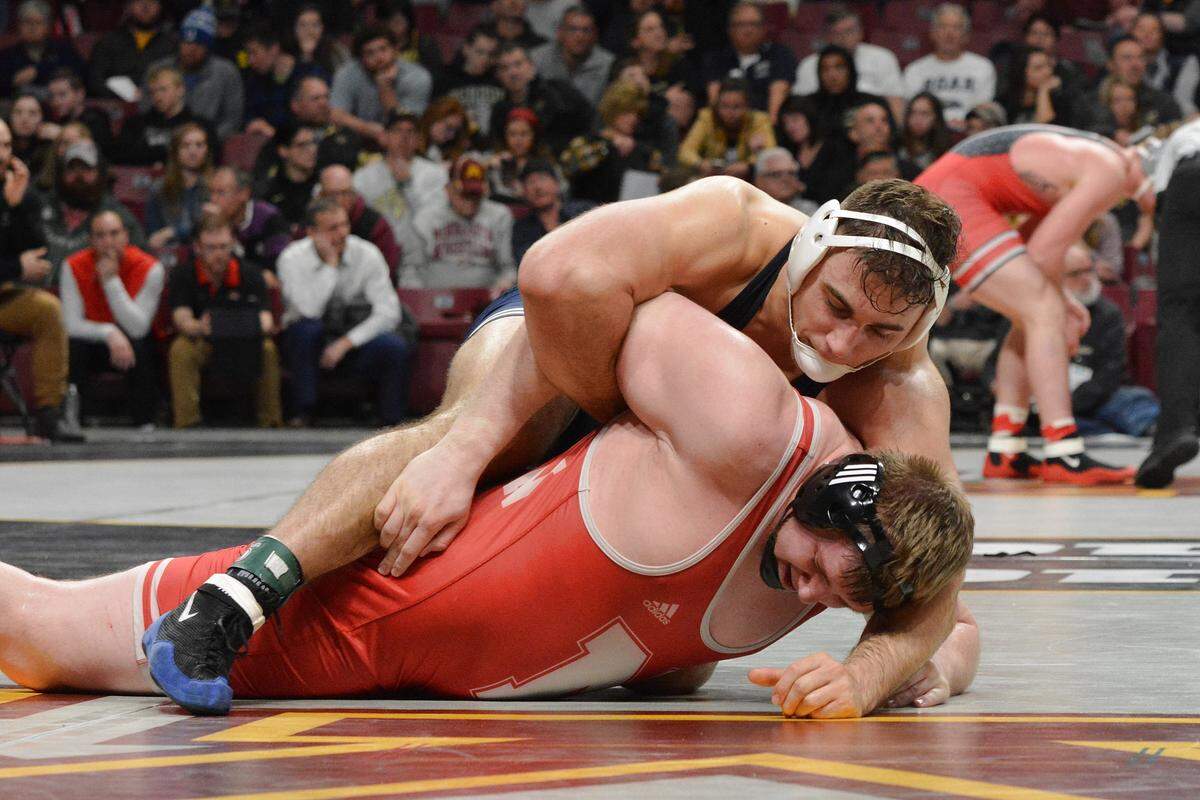 Penn State’s Anthony Cassar looks to score near-fall points on Nebraska’s David Jensen in their 285-pound quarterfinals match of the Big Ten Championships. Cassar beat Jensen 8-4.