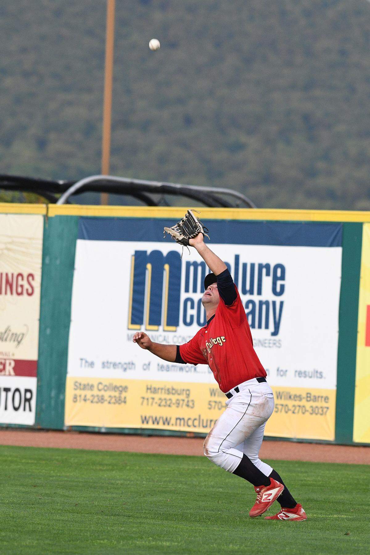 State College’s Andrew Warner looks to make a catch against the Auburn Doubledays at Medlar Field.