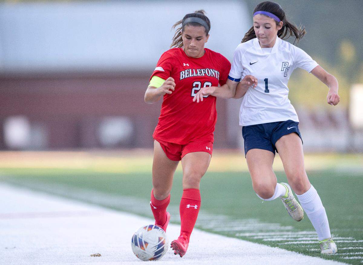 Bellefonte’s Angelina Kasak and Philipsburg-Osceola’s Lily Warlow fight for the ball during the game on Wednesday, Sept. 13, 2023.