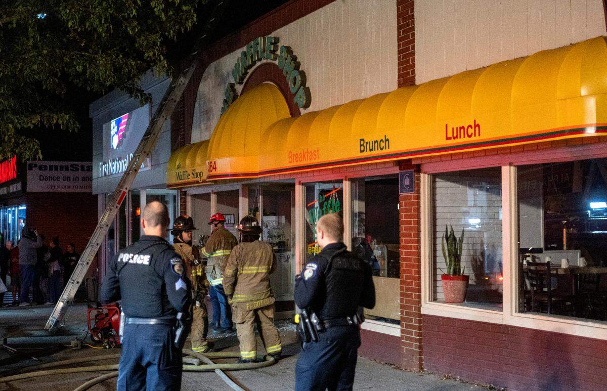 Emergency responders work on the scene of a reported fire at the downtown State College Waffle Shop on Tuesday, Oct. 10, 2023.