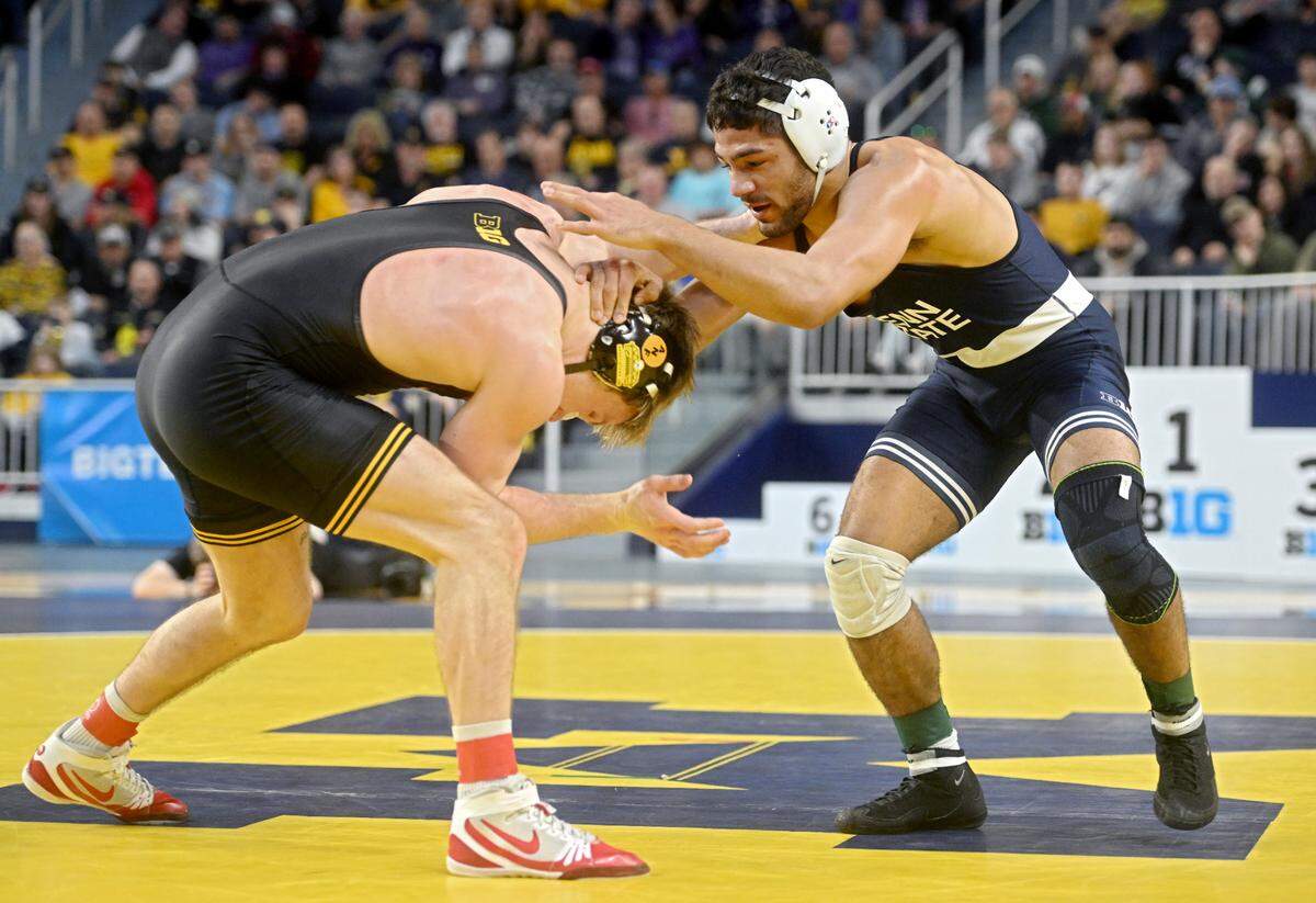 Iowa’s Max Murin and Penn State’s Shayne Van Ness face off in the 149 lb championship bout of the Big Ten wrestling championships at the Crisler Center on Sunday, March 5, 2023.