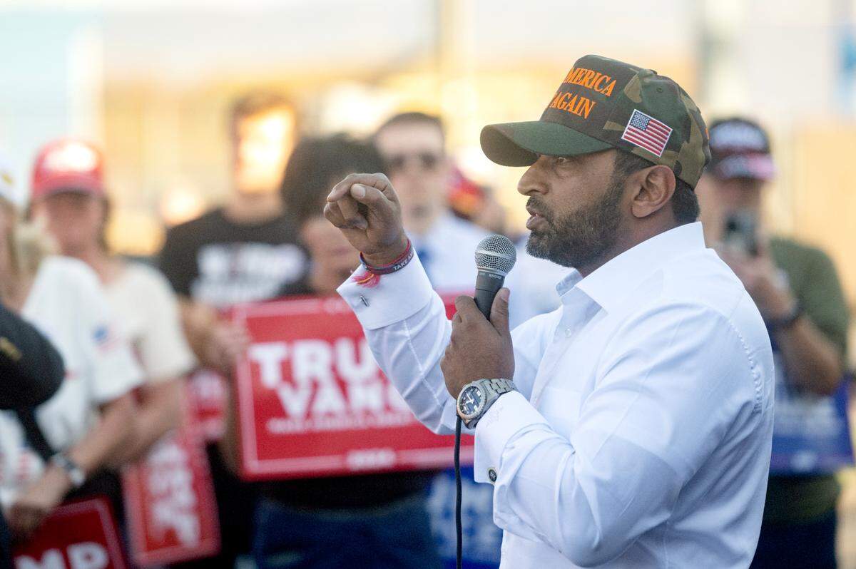 Kash Patel, former Defense Department chief of staff under Trump, speaks to the crowd during a stop of the “Team Trump” bus tour in a parking lot near Beaver Stadium on Tuesday, Oct. 22, 2024.