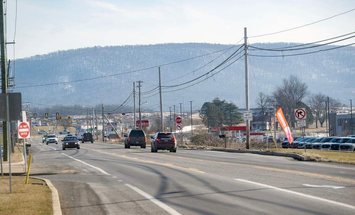 Traffic moves along Benner Pike where several new business have emerged in recent years including Dunkin’ and Giant.
