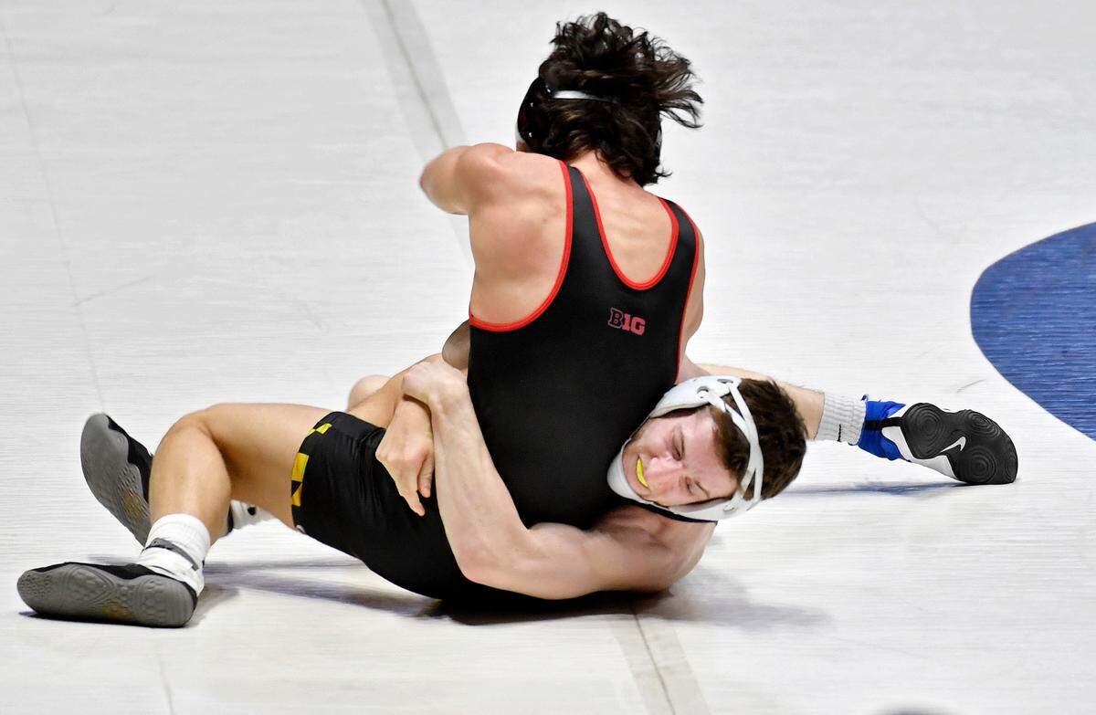 Penn State’s Nick Lee wrestles Maryland’s Danny Bertoni in the 141 lb bout during the match on Monday, Feb. 22, 2021. Lee won by major decision, 14-2.