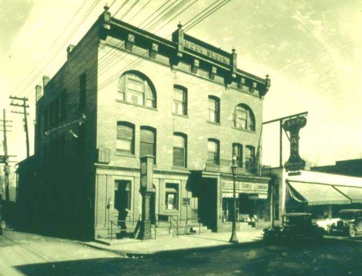 The Meek Building housed the first Peoples National Bank in State College. Its namesake clock can be seen close to the building on the corner. The clock later moved closer to the street when it was reinstalled in 1970 outside the new bank building.