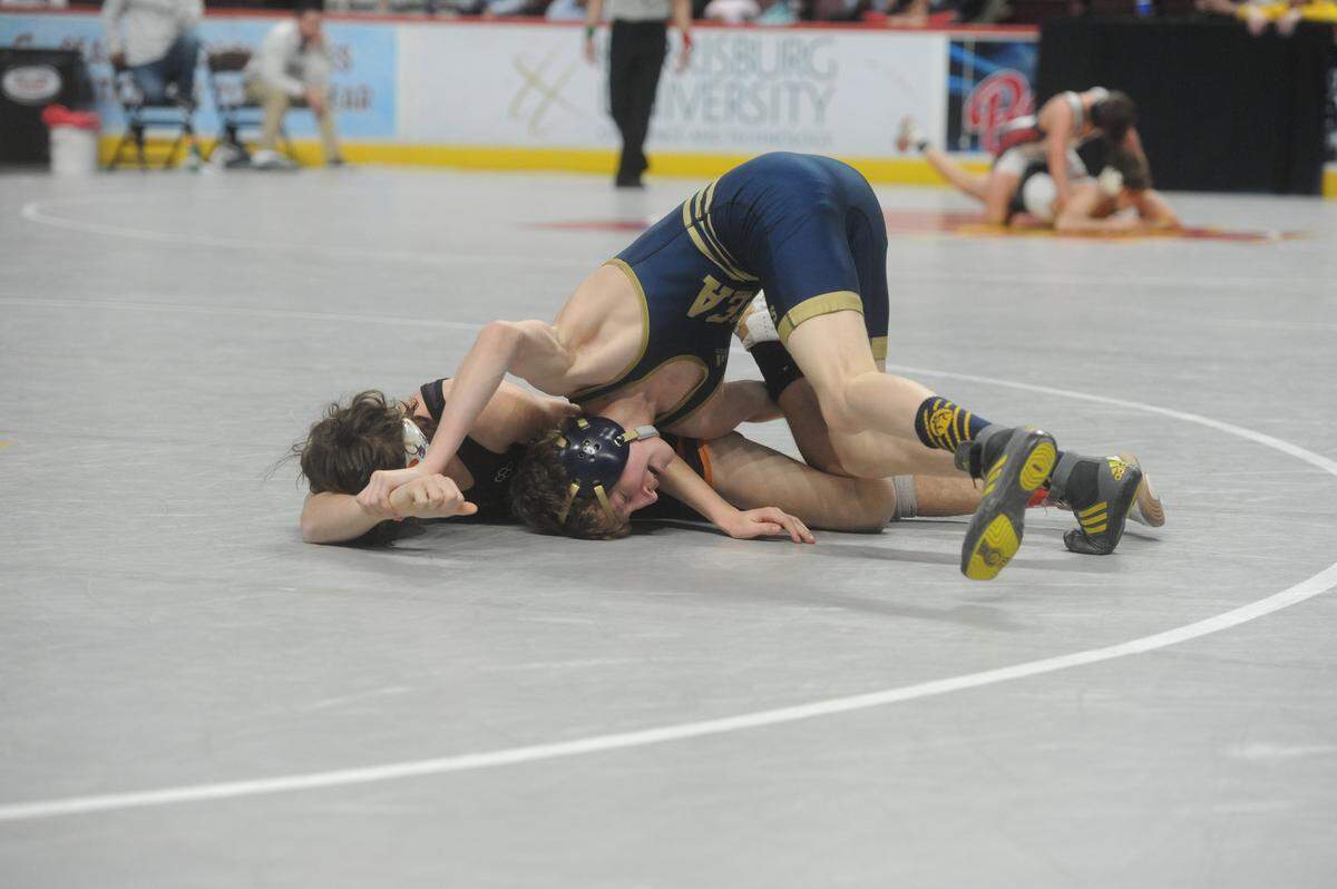 Bald Eagle Area’s Lucas Fye looks to finish off a take down of Danville’s Blake Sassaman in their 113-pound consolation third round match of the PIAA Class 2A Championships on Friday, March 11, 2022 at Giant Center in Hershey. Fye shut out Sassaman, 9-0, to secure a spot on PIAA podium.