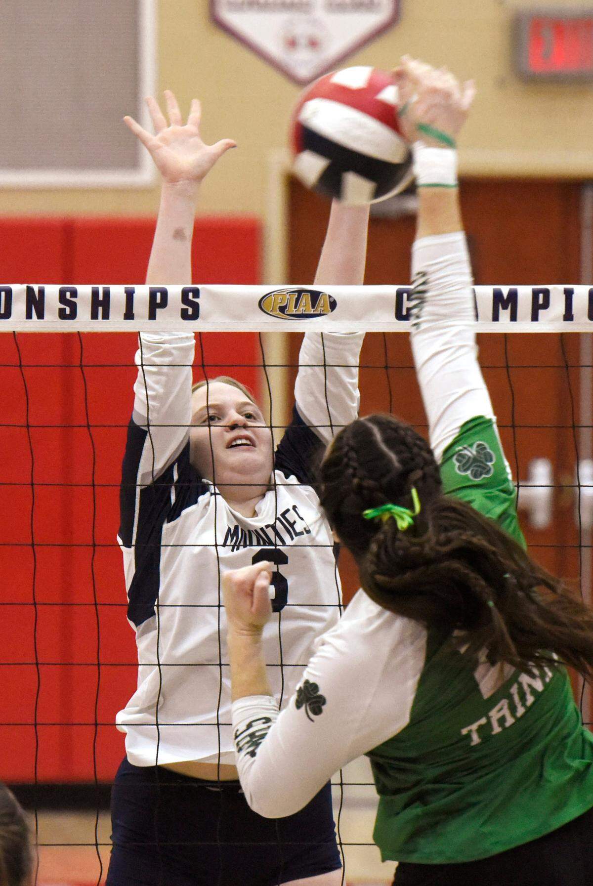 Philipsburg-Osceola’s Megan Johnson blocks the shot of Trinity’s Megan Zack. The Philipsburg-Osceola girls volleyball team won the PIAA Class 2A state championship Saturday, Nov. 18, 2023 at Cumberland Valley in Mechanicsburg. P-O defeated Trinity 3-1.