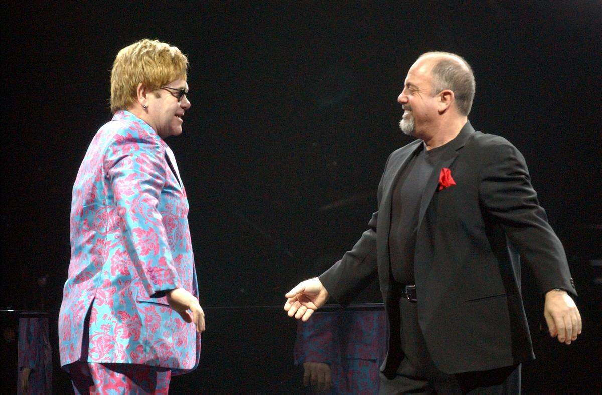 Elton John and Billy Joel greet each other before their concert in a sold -out Bryce Jordan Center On Wednesday, Jan. 16, 2002.