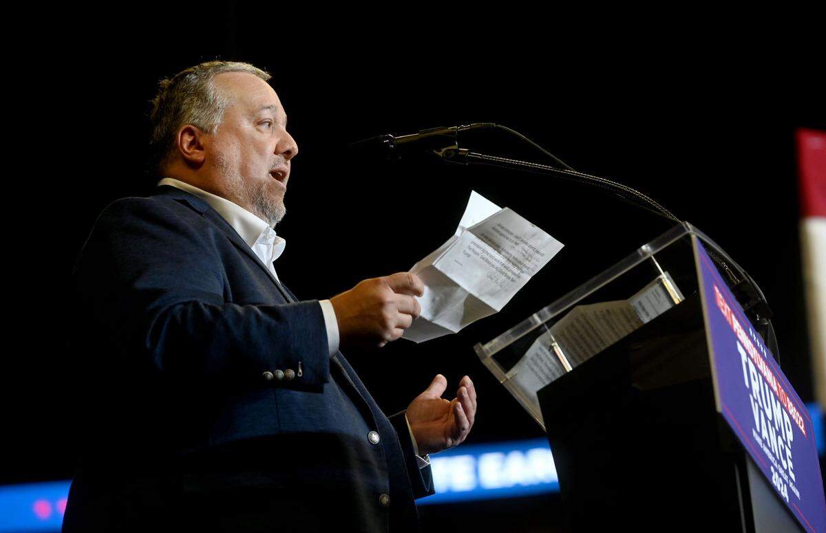 Rob Shearer of SEKO Logistics talks to the crowd at the Donald Trump rally at the Bryce Jordan Center on Saturday, Oct. 26, 2024.