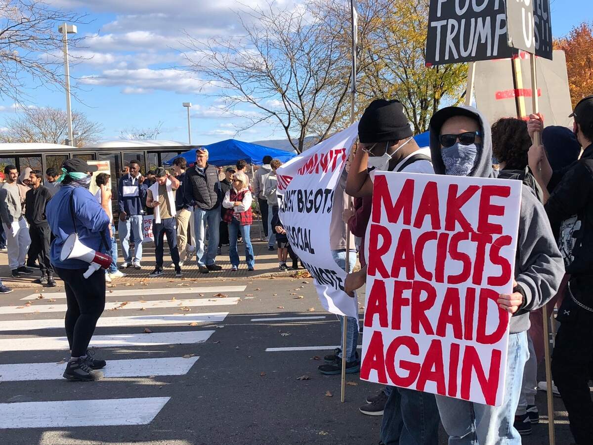 A group comprised mostly of Penn State students protests a campaign rally for former President Donald Trump on Saturday, Oct. 26, 2024.