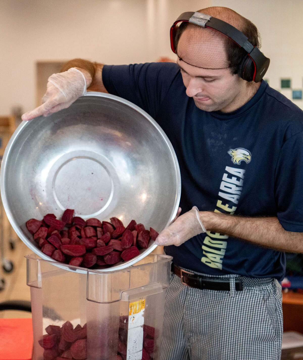Thomas Shaheen sliced a large bowl of beets at Taproot Kitchen on Thursday, August 1, 2024.