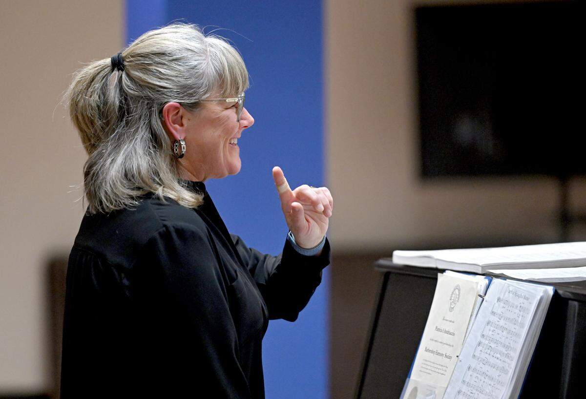 Patricia Andriaccio laughs as she conducts the Nittany Knights during rehearsal on Monday, Feb. 3, 2025 at South Hills School of Business and Technology.